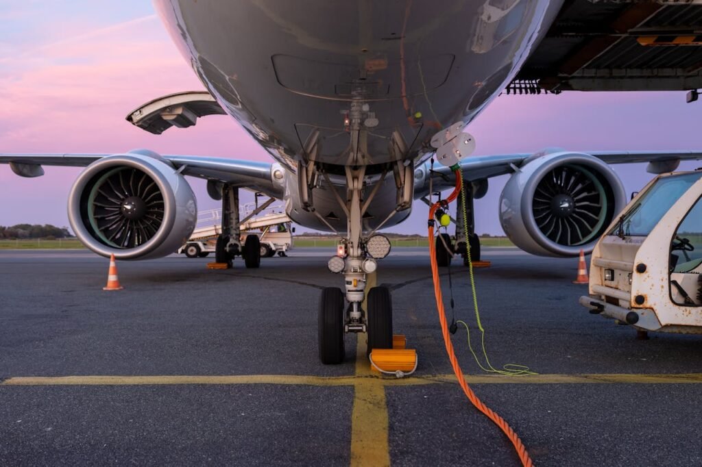 pexels photo 28513293 Close-up view of an airplane undergoing maintenance on the tarmac at sunset.